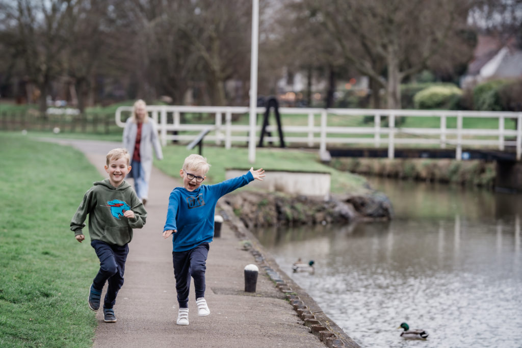 Two boys running next to Droitwich Spa canal 